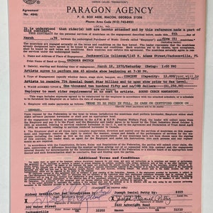 May include: A pink contract form for a musical performance agreement. The contract is for a band called "Grinder Switch" and the performance will take place at the Jacksonville Coliseum on March 18, 1978. The contract is signed by Sidney Drashin/Jet Set Enterprises and Joseph Daniel Petty.