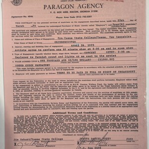 May include: A vintage contract from 1975 between Paragon Agency and the band Grinderswitch for a concert at Gym-Keene State College in Keene, New Hampshire. The document is on pink paper and includes details about the engagement, including the wage of $1,000.