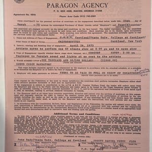 May include: A vintage contract from Paragon Agency for a concert engagement, dated April 24, 1975, with the band Grinderswitch at Cortland State University in New York. The document is pink and features text and signatures.