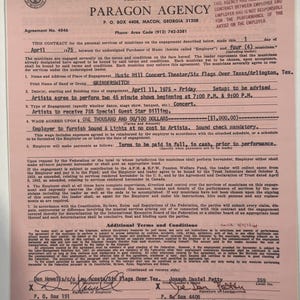 May include: A pink Paragon Agency contract from 1975 for a Grinderswitch concert at Music Mill Concert Theater in Arlington, Texas. The document includes details about the engagement, payment terms, and signatures.
