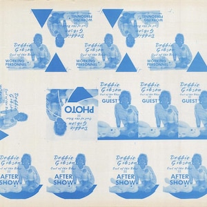 May include: A light blue and white printed sheet featuring multiple images of Debbie Gibson. The images include text that reads "Working Personnel", "Guest", "After Show", and "Photo". The images are arranged in a grid pattern.