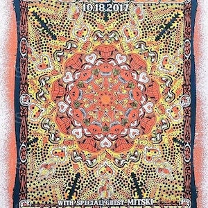 May include: A concert poster for the Pixies at the Fillmore Auditorium on 10.18.2017 with special guest Mitski. The artwork features a vibrant, symmetrical mandala-like design with orange, yellow, and black dots, hearts, and abstract facial features.