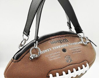 黒の本革ハンドルが付いたブラウン ウィルソン NFL アメリカン