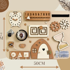 May include: A beige wooden busy board with various activities for toddlers, including a clock, a bell, a latch, a sliding door, a shape sorter, a number line, gears, and an hourglass. The board measures 37 cm by 50 cm.