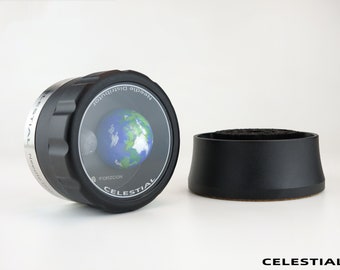 May include: A black and silver needle distributor with a clear lid showing a small globe with the text "FORZZCON CELESTIAL" on the side.