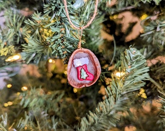 Real Walnut Shell with a Stocking decorated with a Tree Christmas Ornament