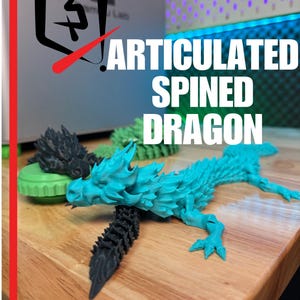 May include: A turquoise articulated spined dragon figurine with a black tail and spine. The text "ARTICULATED SPINED DRAGON" is displayed in white. The base reads "PLASTIC 3D".