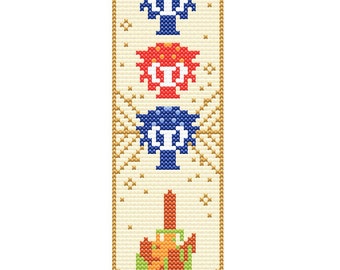 May include: A cross-stitch pattern featuring three mushrooms in a row. The mushrooms are blue, red, and blue with white spots. The background is a light beige with a gold border.