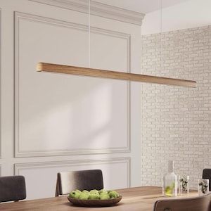 Oak linear pendant light over the dining table.