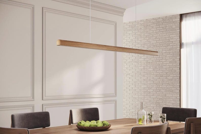 Oak linear pendant light over the dining table.