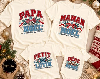 Könnte beinhalten: Vier cremefarbene T-Shirts und ein Baby-Body mit weihnachtlichen Grafiken. Die Oberteile zeigen die Schriftzüge Papa Noël, Maman Noël, Petit Lutin und Bébé Renne, jeweils mit dem Text L'équipe du Pôle Nord und festlichen Motiven.