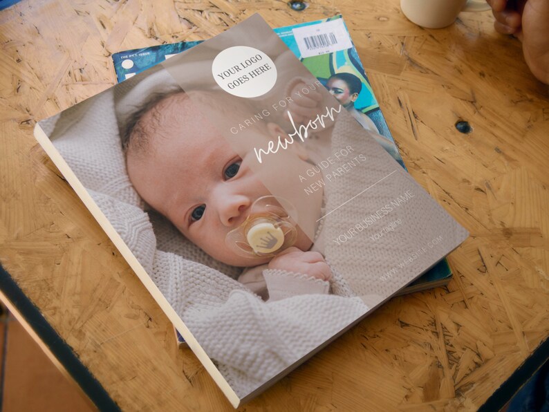 May include: A guide for new parents titled "Caring for Your Newborn". The cover features a close-up photo of a baby wearing a white knitted sweater and a pacifier. The text "Your Logo Goes Here" is in the top right corner.