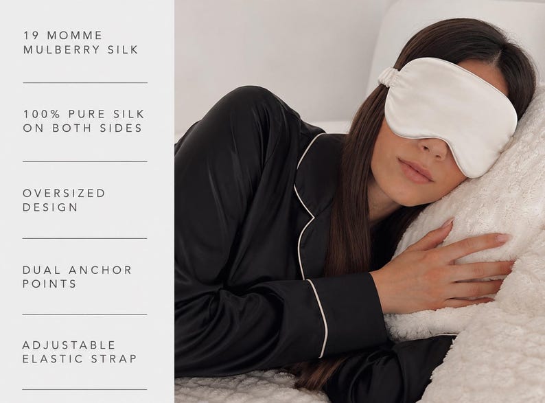 May include: A cream-coloured silk sleep mask with an adjustable elastic strap and an oversized design. The text reads: 19 MOMME MULBERRY SILK, 100% PURE SILK ON BOTH SIDES, OVERSIZED DESIGN, DUAL ANCHOR POINTS, ADJUSTABLE ELASTIC STRAP.