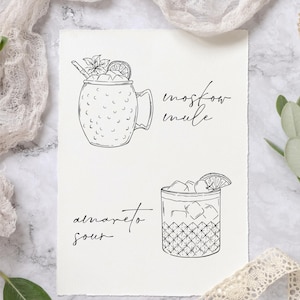 May include: A black and white line drawing of two cocktails. The first is a Moscow Mule in a copper mug with a lime wedge and mint sprig. The second is an Amaretto Sour in a rocks glass with a lime wedge and ice cubes. The text "Moscow Mule" and "Amaretto Sour" is written below each cocktail.