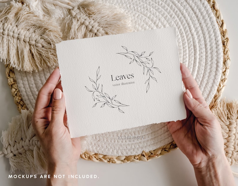 May include: A white paper with the word "Leaves" and a vector illustration of leaves. The paper is held by hands and rests on a woven placemat. The text "vector illustration" is below the word "Leaves".