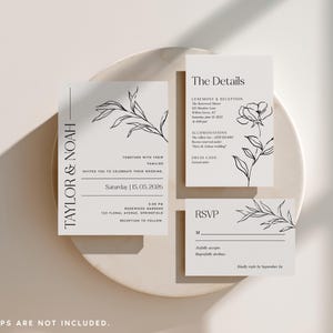 Puede incluir: Un juego de tres tarjetas de papeler&iacute;a de boda blancas con dibujos de l&iacute;neas negras de hojas y flores bot&aacute;nicas. Las tarjetas incluyen texto para Taylor & Noah, The Details y RSVP, con informaci&oacute;n del evento impresa en una fuente serif clara.