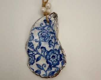 Natural oyster decoupaged with blue and white flowers ornament