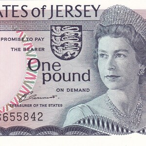 May include: A Jersey one-pound banknote featuring a portrait of Queen Elizabeth II, with the text "The STATES of JERSEY" at the top. The note includes the text "PROMISE TO PAY THE BEARER One pound ON DEMAND". The serial number is HB655842.