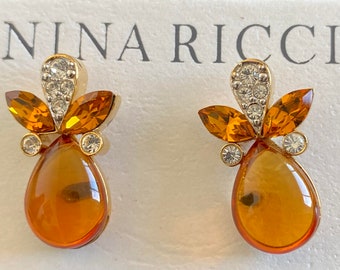 Nina Ricci Pierced Earrings.  Triple 22kt gold plated w handset Topaz resin stones. Handset Swarovski clear & topaz crystals. Designer NEW,