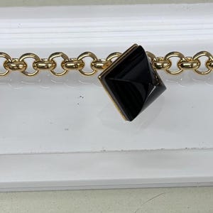 Nina Ricci Armband, Signiert, Dreifach 22kt vergoldet, mit 3 Jet Swarovski Kristallen