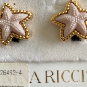Nina Ricci Clip Star shaped earrings. Triple 22kt gold plated with Pink centers. Designer, Vintage, Canadian, New Pair