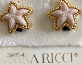 Nina Ricci Clip Star shaped earrings. Triple 22kt gold plated with Pink centers. Designer, Vintage, Canadian, New Pair