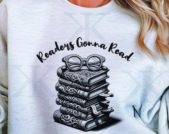 May include: A gray sweatshirt with the text "Readers Gonna Read" and a stack of books with glasses on top.