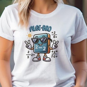 May include: White t-shirt with the text "ALGE-BRO" above a cartoon math equation character wearing sunglasses and giving the peace sign. The character has a blue book body, red shoes, and various math equations around it.
