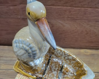 Pelican in a Boat Ceramic Figurine