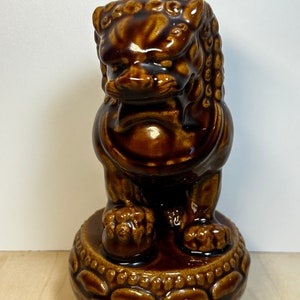 Brown ceramic foo dog statue
