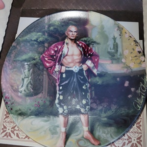 The Puzzlement Bradford exchange collectable plate, in box with certificates
