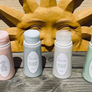 May include: Four 3.4 ounce bottles of all-natural sunblock. The bottles are labeled "All Natural Sunblock" and are in pink, blue, white, and green.