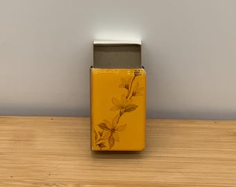 Vintage tobacciana empty case, yellow clear coat with flowers
