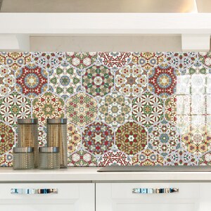 May include: A kitchen backsplash featuring a colourful geometric pattern of hexagonal tiles. The tiles incorporate a blend of red, green, blue, and yellow hues with intricate floral designs.