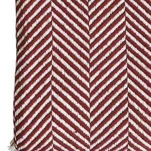 May include: A textile fabric featuring a prominent herringbone pattern in alternating stripes of deep brick red and off-white. The woven material displays a consistent diagonal texture throughout, creating a repeating chevron design across the surface.