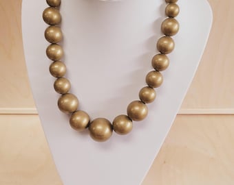Wooden beads, a string of wooden beads + a bracelet hand-painted in gold color on elastic bands.