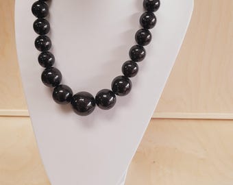 Wooden beads, a string of wooden beads + a bracelet hand-painted in black color on elastic bands.