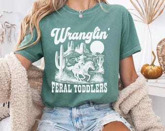 Wranglin’ Feral Children Shirt, Daycare Provider Tee, Preschool Teacher Western Graphic Shirt, Funny Toddler Tamer Gift