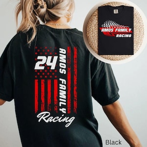 May include: Black t-shirt featuring a design with the number 24, the words "AMOS FAMILY" and "RACING" in white, and a distressed American flag graphic. A smaller version of the shirt is displayed on a woven mat.