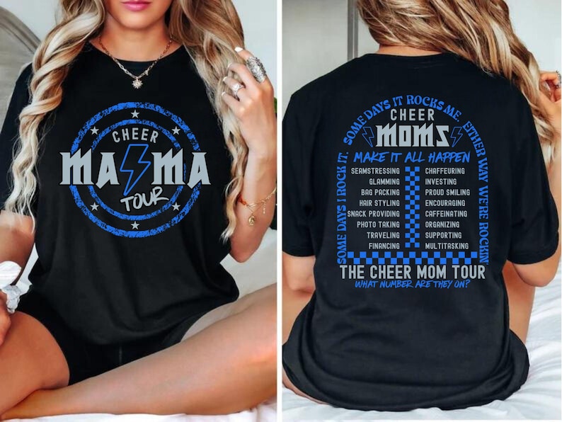 May include: Black t-shirt with a blue and white graphic that says "Cheer Mama Tour" on the front and "Some days it rocks me, some days I rock it. Cheer Moms make it all happen. The Cheer Mom Tour. What number are they on?" on the back.