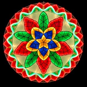 May include: A circular lantern featuring a multi-layered floral design with illuminated red, green, yellow, and blue panels. The structure displays a central star shape surrounded by leaf-like petals, all outlined with bright LED lights against a black background.
