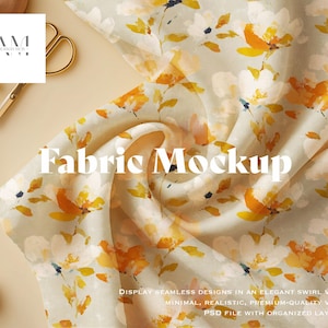 Könnte beinhalten: Stoff-Mockup mit floralem Muster aus gelben und weißen Blumen auf hellem Hintergrund. Der Text "Fabric Mockup" ist prominent dargestellt. Eine goldene Schere und ein Zweig mit Grün sind ebenfalls zu sehen.