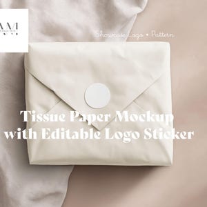 May include: A mockup of tissue paper wrapped in a cream-colored envelope, sealed with a white circular sticker. The text "Tissue Paper Mockup with Editable Logo Sticker" is displayed in white. The AM Design Hub logo is in the upper left corner.