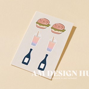 May include: A sheet of stickers with food and drink illustrations. The stickers depict two burgers, two bubble tea drinks, and two champagne bottles. The stickers are on a white background with the text "AM DESIGN HUB" at the bottom.