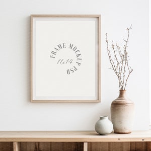May include: A light wood frame mockup with a white background and the text "FRAME MOCKUP 11x14 PSD" inside the frame. A vase with dried branches and white flowers sits on a light wood shelf with a light wood background.