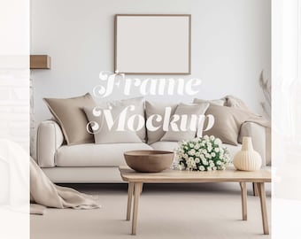 May include: A white sofa with beige cushions in a living room setting. A wooden coffee table with a bowl and flowers sits in front of the sofa. A framed picture hangs on the wall above the sofa. The text "Frame Mockup" is superimposed on the image.