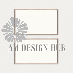 May include: Two rectangular wooden framed art prints with white interiors. The text "AM DESIGN HUB" is printed in gray on the bottom frame. The frames are light brown. A gray floral design is on the left.