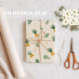 May include: A gift wrapped in cream-colored paper with a repeating pattern of green sprigs and yellow accents, tied with twine. A roll of paper, scissors, and a sample of the wrapping paper are also visible. The text "AM DESIGN HUB" is in the upper left corner.