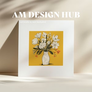 May include: A white vase with a bouquet of white flowers with orange accents on a yellow background. The text "AM DESIGN HUB" is at the top of the image and the text "artwork is not included" is below the image.