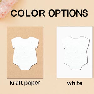 May include: The image displays two baby bodysuit cutouts, one on kraft paper and the other on white paper. The text "COLOR OPTIONS" is at the top. The kraft paper cutout is on the left, and the white paper cutout is on the right.